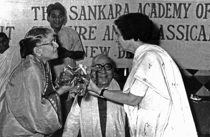 Receiving a bouquet from Smt Indira Gandhi
